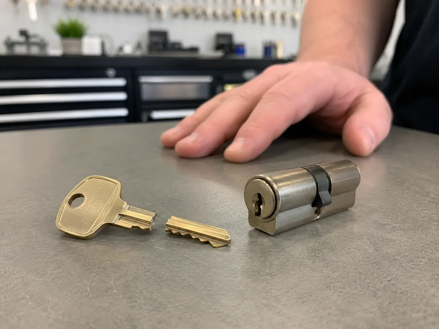 Locksmith removing a broken key from a door lock